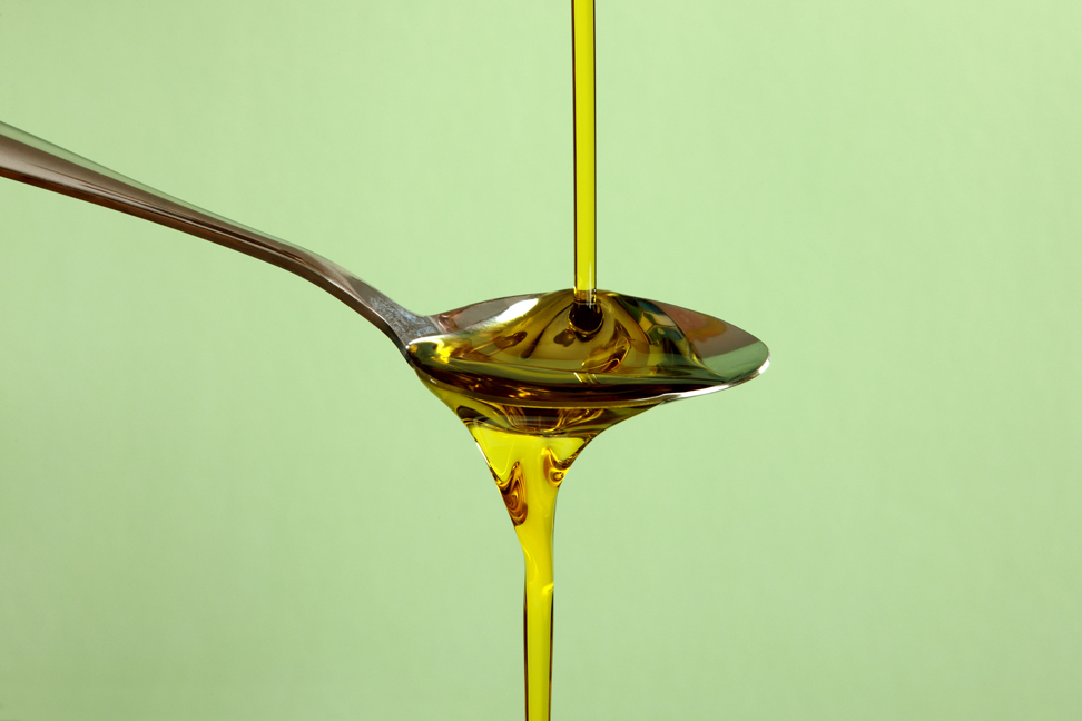 Olive oil with olive branch